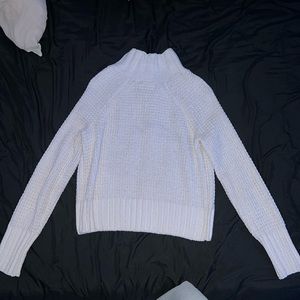 White knit turtleneck sweater.